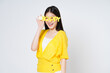 Young asian woman smiling and wearing HAPPY glasses isolate white background.