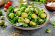 Delicious salad with Brussels sprouts and lettuce on table