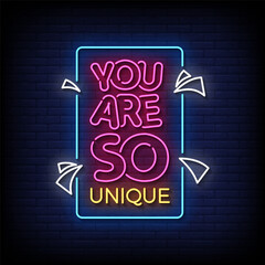 Wall Mural - you are so unique neon Sign on brick wall background 