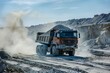 Truck moves sand in an open gravel mine