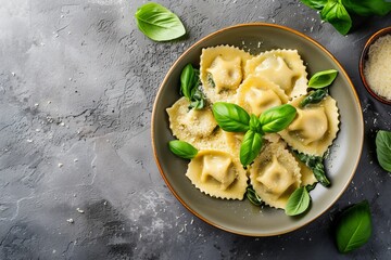 Spinach and ricotta stuffed homemade Italian ravioli pasta served with tomato sauce parmesan and basil