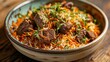 Aromatic biryani rice garnished with fragrant herbs and served with tender pieces of succulent lamb.