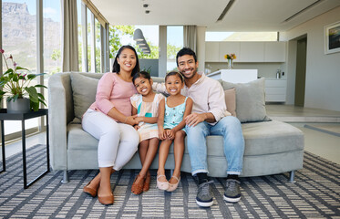 Wall Mural - Mexican family, portrait and smile with children in home for bonding connection, daughters or sofa. Mother, father and siblings on couch in living room with embrace for love support, care or weekend