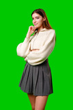 Fototapeta  - Woman in Skirt and Sweater Posing for Picture