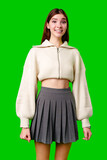 Fototapeta  - Young Woman Smiling in Front of a Green Screen Wearing Casual Clothing