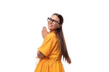 Wall Mural - young pretty brunette lady dressed in yellow dress inspired by an idea