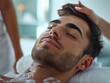 Man is relaxing lying in a bathtub, smiling, spa ambience, beauty spa procedure