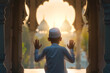 Photo back view of asian muslim kid with cap praying