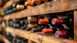 © Hector - An assortment of aged wine bottles stored in a rustic wooden wine rack, highlighting the charm and history of a well-stocked cellar