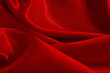 Dark red fabric texture background, detail of silk or linen pattern.