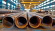 The industrial workshop has large diameter pipes.