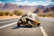 Turtle crossing desert road with mountains in the background.