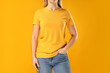 A young woman in a yellow T-shirt