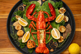 Fototapeta Sport - Grilled Lobster with Cheese in wood plate, Grilled Canadian Lobster on wooden background.