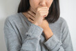 Close-up of Female asian have a flu and coughing isolated on background