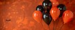 Festive orange and black balloons