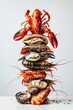 A vertical assortment of various seafood delicacies against a white background