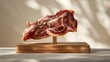 Sliced cured ham displayed on a wooden stand with elegant shadows in background