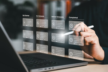 Project handler or manager uses a pen to manage project progress plan by responsible methodology board tool on interface screen. Process, task list, workflow, due date, planner, management software.