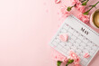 Blooming time for Mother's Day theme. Calendar adorned with delicate carnations and hearts on a pink background
