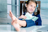 Fototapeta Mapy - Money may buy happiness concept. Happy beautiful  child business girl working in the office. Horizontal image.