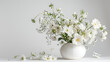 a stunning advertising photography featuring an elegant verbena arrangement with white lisianthus flowers. the beauty of the flower stems and leaves is showcased against a white  background 