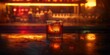 An amber-colored whiskey on the rocks served on a warm, illuminated bar counter, evoking a nocturnal ambiance.