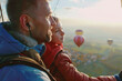 Father and Son Enjoying Hot Air Balloon Ride at Sunset
