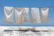 Freshly washed clothes hanging on the balcony with a bright blue sky professional photography
