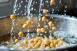 Rinsing Chickpeas in a Colander Under Running Water for Healthy Meal Preparation