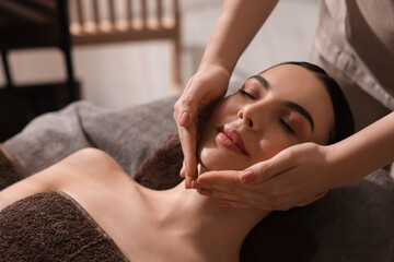 Canvas Print - Spa therapy. Beautiful young woman lying on table during massage in salon