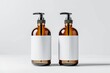 two amber bottles with plain and blank white label on grey background