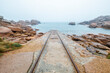 Guide rails for lowering fishing boats on the pink granite coast at Ploumanac'h in Brittany, France.