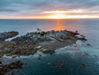 Sunrise in Harbour is a small rocky islet flanked by a narrow red-and-white lighthouse house, 1.8 km from the shore of Saint-Quay-Portrieux. It signals the reefs of the Saint-Quay rocks.