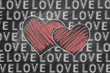 Fototapeta  - Hand drawn illustration of two hearts outlined in chalk and word LOVE is repeated throughout the image on a blackboard
