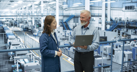 Aufkleber - Experienced Middle Aged Engineer Giving an Electronics Factory Tour to Young Japanese Student. Asian Female with Technical Background Asking Questions About Production, Manufacturing, Research