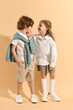 © New Africa - Fashion concept. Stylish children on pale orange background