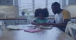 Image of data processing over african american father and daughter doing homework