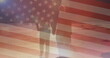 Image of flag of usa over caucasian couple holding hands and walking