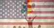 Image of flag of usa over diverse friends holding balloons