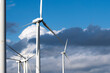 © yaqui_villegas - Expansive view of a wind turbines farm under dancing clouds, reflecting the eco-friendly energy mesmerizing Catalonia, Spain, and Tarragona