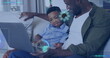 Image of data processing over happy african american father and son using laptop at home