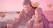 Image of heart icons over caucasian father with child at beach