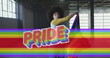 Image of rainbow flag over african american woman waving with flag