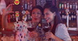 Image of social media reactions over happy caucasian women drinking wine and taking selfie