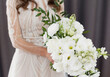 Bride with white wedding bouquet