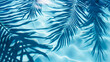 A blue pool with palm tree leaves and a shadow on the water