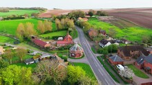 Aerial Drone Footage Of A Small Lincolnshire Village Called Burwell In The UK. Typical English Rural Village Scene.
