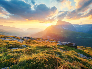 Canvas Print - A beautiful mountain landscape with a bright sun shining on the grass