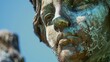 Closeup of a controversial statue in need of restoration sparking debate over the erasure of controversial aspects of history versus preserving it in its original state. .